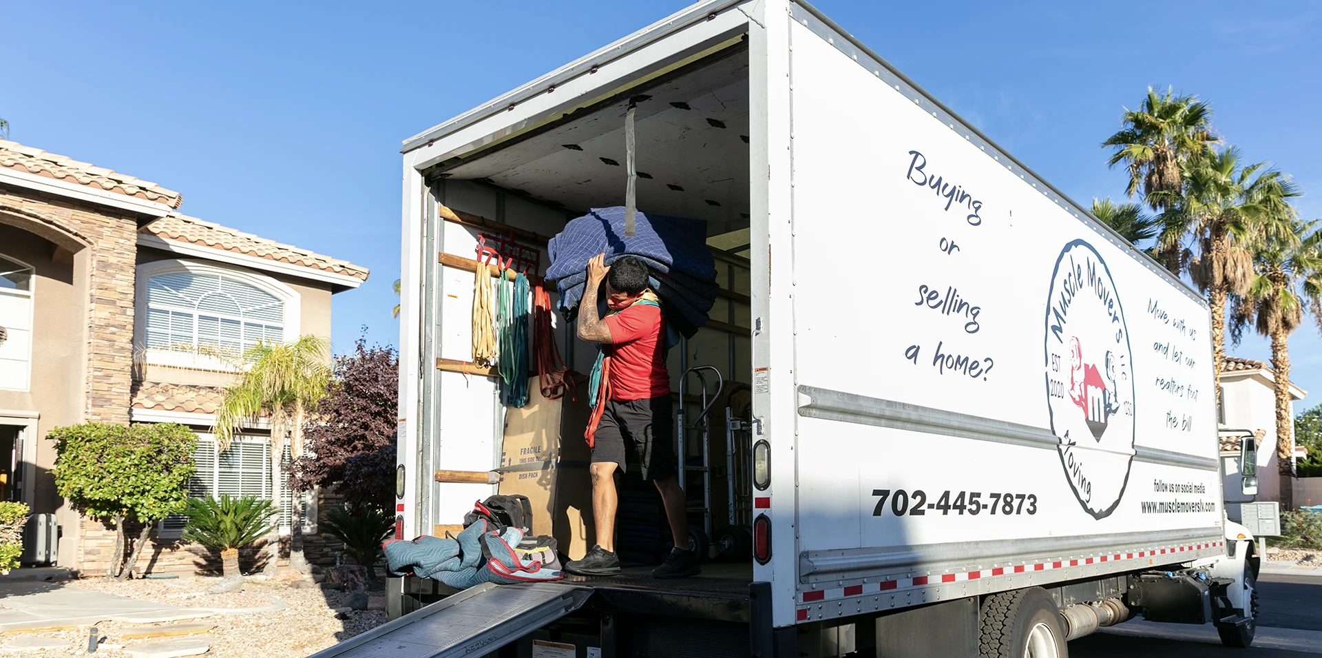 A Muscle Movers truck loading at a home in the north Las Vegas valley.