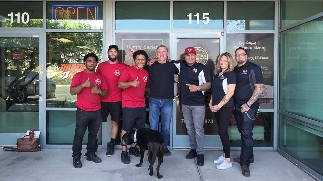 The Muscle Movers team outside a Las Vegas commercial building before an office move.