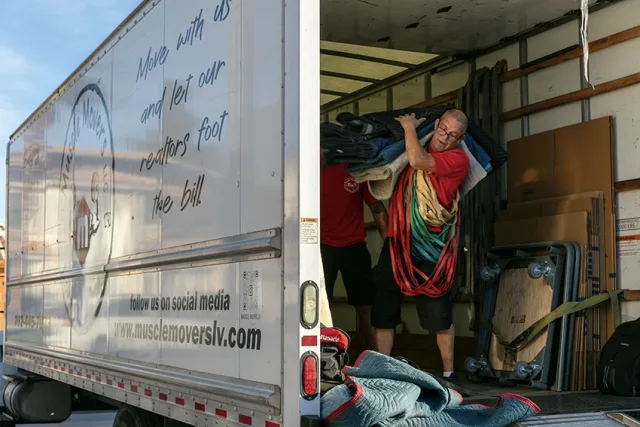Muscle Movers crew loading furniture into the truck for a local Las Vegas move.